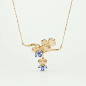 Collier plastron iris doré et cristal bleu